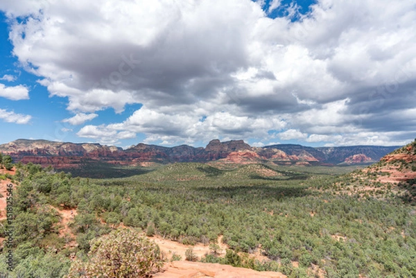 Obraz Sedona, Arizona, red rock formations and scenic landscapes under dramatic cloud-filled skies, capturing the natural beauty of the desert wilderness.
