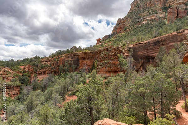 Obraz Sedona, Arizona, red rock formations and scenic landscapes under dramatic cloud-filled skies, capturing the natural beauty of the desert wilderness.