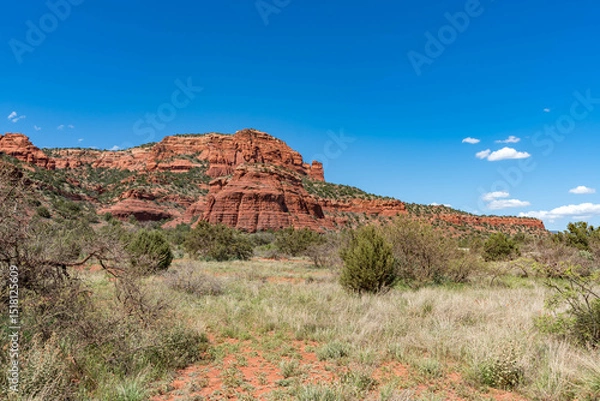Obraz Sedona, Arizona, red rock formations and scenic landscapes under dramatic cloud-filled skies, capturing the natural beauty of the desert wilderness.