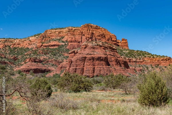 Obraz Sedona, Arizona, red rock formations and scenic landscapes under dramatic cloud-filled skies, capturing the natural beauty of the desert wilderness.