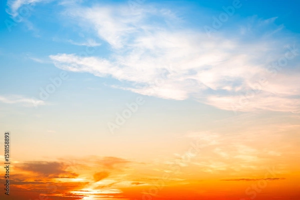 Fototapeta Beautiful , luxury soft gradient orange gold clouds and sunlight on the blue sky perfect for the background, take in evening,Twilight, Large size, high definition landscape photo
