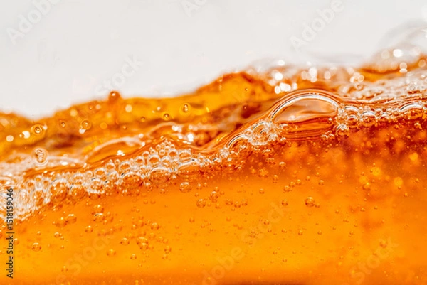 Fototapeta Close up bright orange Oil or beer splash texture and nature waves, Beautiful waves curve and little bubbles smooth for graphic design and background, Oil Bubbles, Soft beer bubbles, Selective focus
