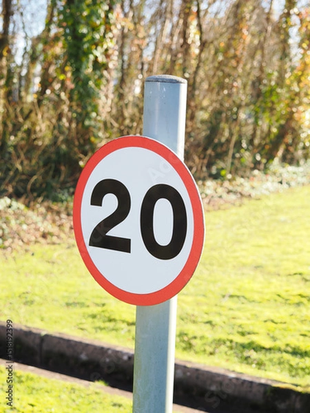 Obraz close up of a UK maximum road speed limit sign showing 20 mph as the top speed