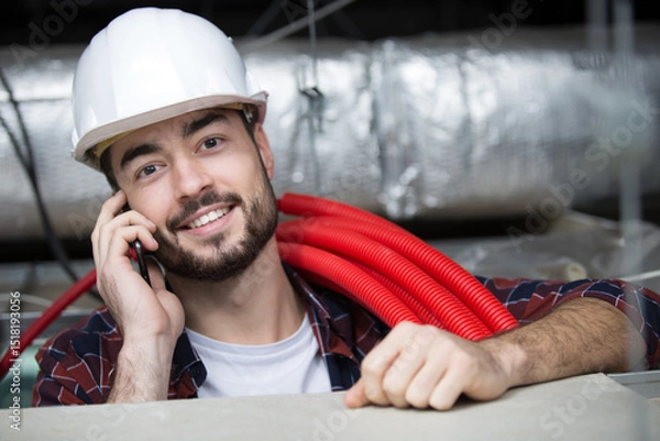 Fototapeta engineer talking on the phone