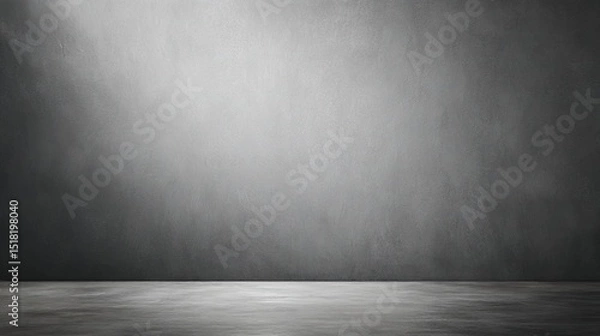 Fototapeta Minimalist gray cement wall with soft lighting, evoking simplicity and modern abstraction.
