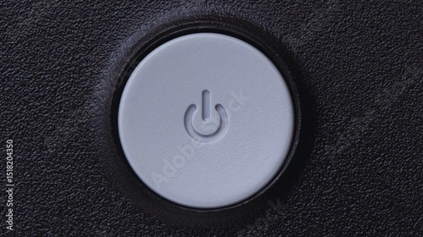 Fototapeta Close-up of a power button, a symbol for starting or stopping technology, on a clean white or black background