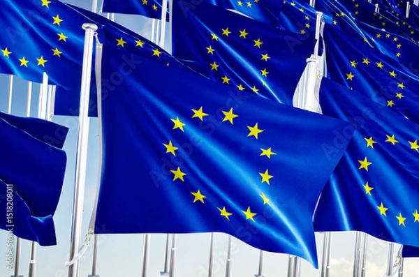 Obraz Many european union flags over blue sky background.