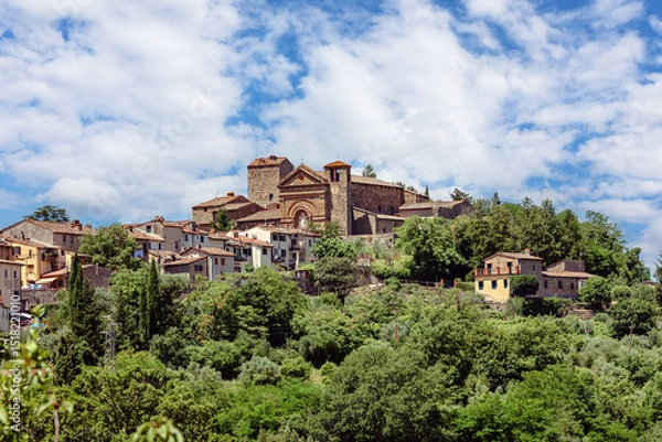 Fototapeta The medieval village of Montecatini Alto, located in the province of Pistoia in Italy, is nestled atop a hill and showcases its beautiful medieval architecture surrounded by lush greenery.