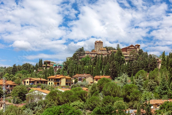 Fototapeta The medieval village of Montecatini Alto, located in the province of Pistoia in Italy, is nestled atop a hill and showcases its beautiful medieval architecture surrounded by lush greenery.