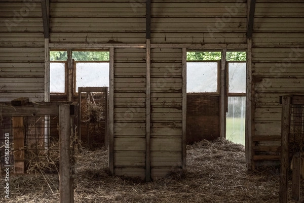 Fototapeta Interior of a rustic stable for animals in the countryside.