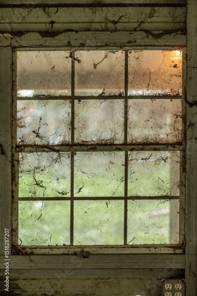 Fototapeta Close-up of an old window on an old wooden wall.