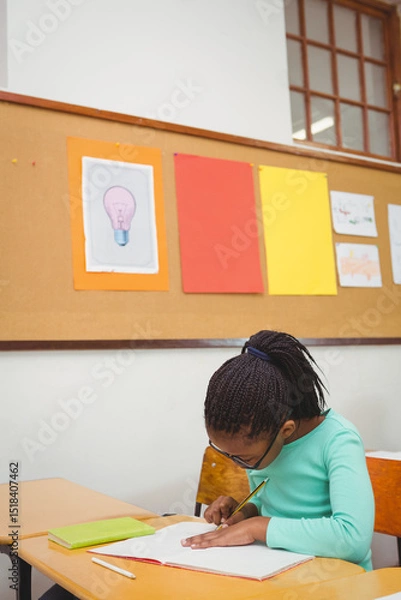 Fototapeta Notebook is lying on desk in classroom as pencil is resting on green book near window