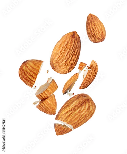 Fototapeta Levitation of whole and broken almonds in the air isolated on white background
