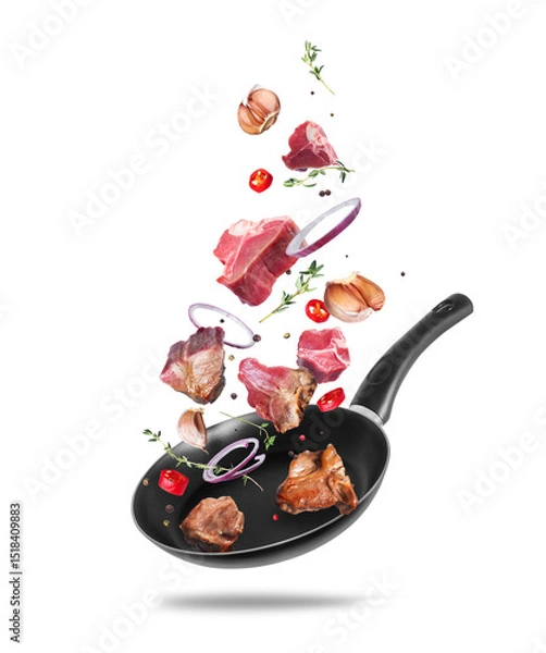 Fototapeta Raw and fried beef steaks with ingredients for cooking meat in a pan