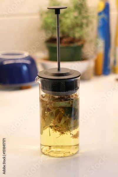 Obraz Linden blossom tea; Close-up of linden blossom brewed in a transparent vessel