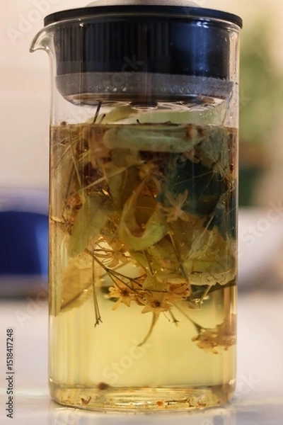 Obraz Linden blossom tea; Close-up of linden blossom brewed in a transparent vessel