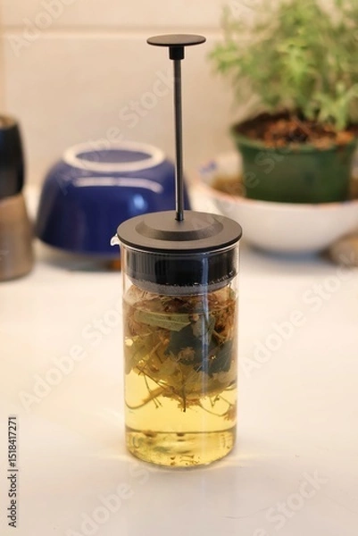 Obraz Linden blossom tea; Close-up of linden blossom brewed in a transparent vessel