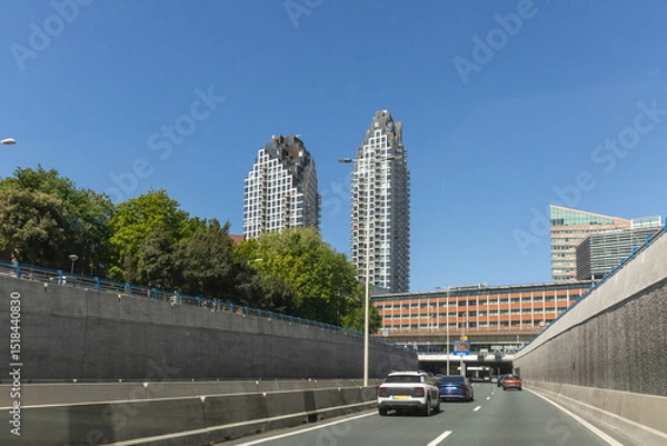 Obraz Utrechtsebaan A12 highway in The Hague, Netherlands, seen from a tunnel road with traffic on a sunny day, showcasing urban development and design.