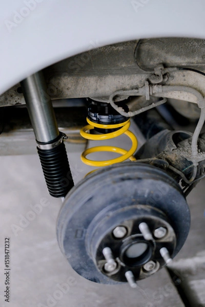 Fototapeta Yellow springs for cars.Upgrade your car's springs to be more efficient.Install new springs and shocks into the vehicle.Install springs and shocks on the back of the vehicle.