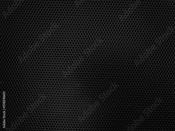 Fototapeta Hexagonal black mesh pattern forming a grid-like texture with subtle lighting variation creating a sense of depth and shadow across the surface, hinting at a metallic or fabric material