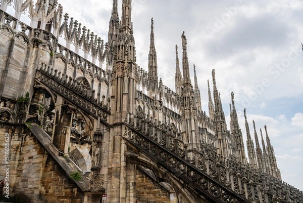 Obraz Milan, Italy Gothic cathedral spires architecture detail in urban setting, Milan Duomo Cathedral.