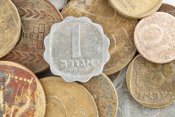 Fototapeta The old Israeli shekel currency before being replaced. The 1 agora coin is copper aluminium nickel.