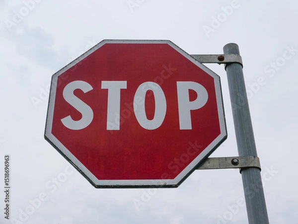 Obraz stop sign over cloudy sky