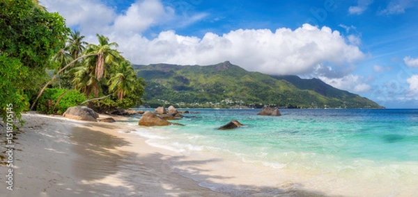 Fototapeta Panoramic view of tropical Sunny beach and turquoise sea on Beau Vallon beach, Seychelles. Summer vacation and tropical beach concept.