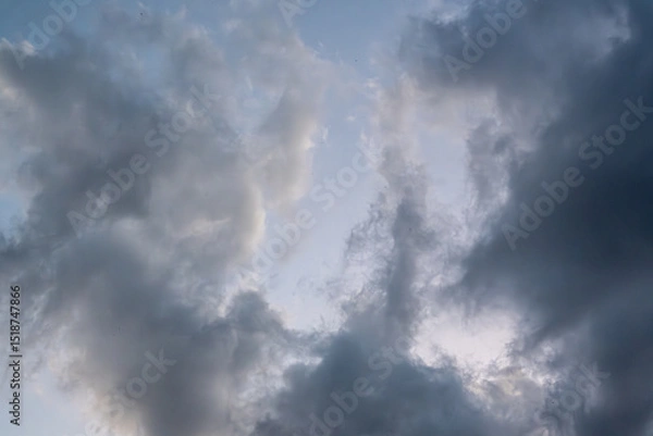 Obraz Dramatic cloudy sky before a storm, with swirling dark and light cloud formations. Ideal for background or texture use.