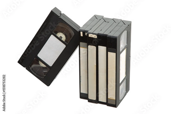 Fototapeta Group of vintage VHS video tapes with blank labels, standing and leaning on white back