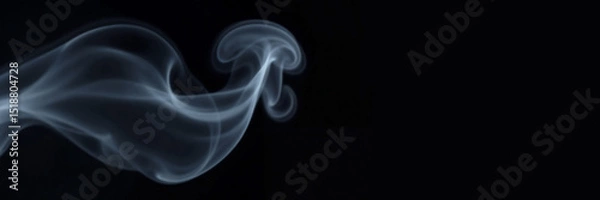Fototapeta Artistic Smoke Effect with mysterious and ethereal mood showcasing delicate wisps of smoke on dark background