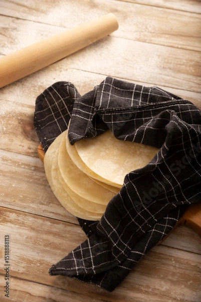 Fototapeta Tortillas de Harina, also called wheat tortilla, is a flat bread made with wheat flour and lard or butter, without yeast, and widely consumed daily in Mexico, especially in the north of the country.