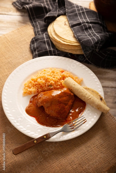 Fototapeta Pipian with Chicken, food from Mexico and other Latin American countries, chicken meat bathed in mole sauce made with pumpkin seeds, dried chili peppers and several other ingredients.