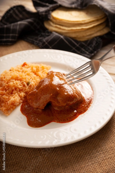 Fototapeta Pipian with Chicken, food from Mexico and other Latin American countries, chicken meat bathed in mole sauce made with pumpkin seeds, dried chili peppers and several other ingredients.