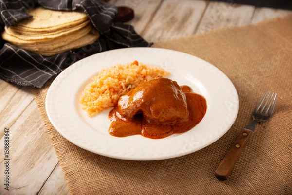 Fototapeta Pipian with Chicken, food from Mexico and other Latin American countries, chicken meat bathed in mole sauce made with pumpkin seeds, dried chili peppers and several other ingredients.
