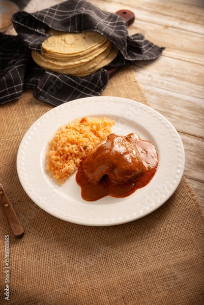 Fototapeta Pipian with Chicken, food from Mexico and other Latin American countries, chicken meat bathed in mole sauce made with pumpkin seeds, dried chili peppers and several other ingredients.