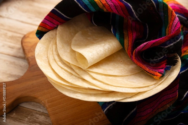 Fototapeta Tortillas de Harina, also called wheat tortilla, is a flat bread made with wheat flour and lard or butter, without yeast, and widely consumed daily in Mexico, especially in the north of the country.