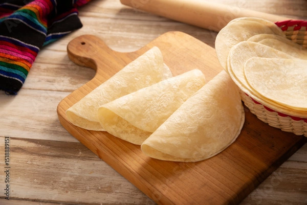 Fototapeta Tortillas de Harina, also called wheat tortilla, is a flat bread made with wheat flour and lard or butter, without yeast, and widely consumed daily in Mexico, especially in the north of the country.