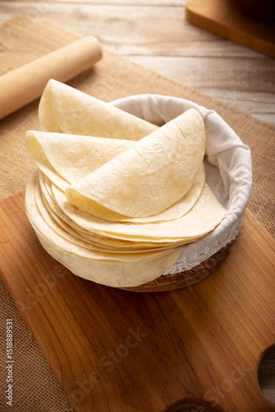 Fototapeta Tortilla de Harina, also called wheat tortilla, is a flat bread made with wheat flour and lard or butter, without yeast, and widely consumed daily in Mexico, especially in the north of the country.