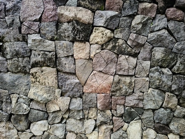 Fototapeta Stack of neatly arranged rocks, textured stone background