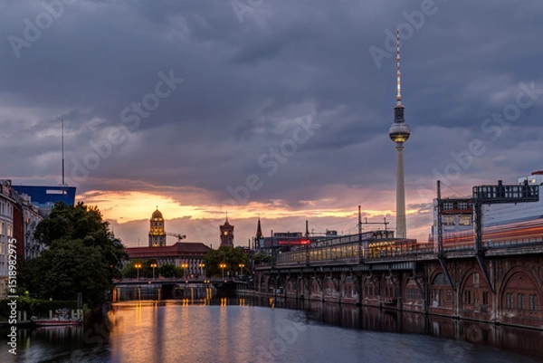 Fototapeta The famous Television Tower and the river Spree in Berlin after sunset