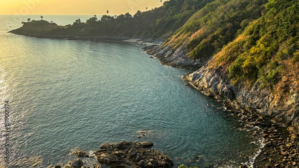 Fototapeta Sea Landscape at Dusk with Vibrant Sky and Calm Waters, Captured from Promthep Cape, Phuket, Thailand