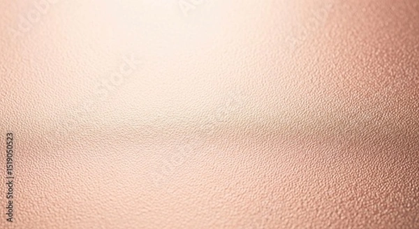 Obraz Textured rose gold metallic surface with a subtle sheen and fine-grained pattern, an elegant abstract background.
