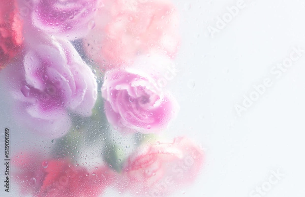 Fototapeta Bright beautiful bouquet of purple white and red flowers arrangement behind a white matte glass blurry with water drops,soft focus,DOF- depth of field