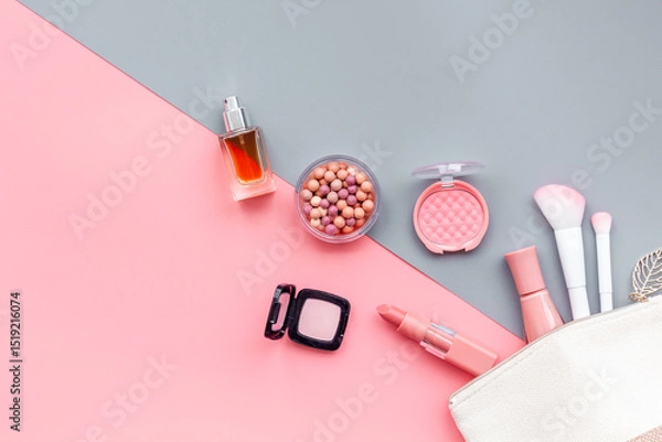 Obraz Layout of cosmetic bag with makeup brown pink shade beauty products, top view