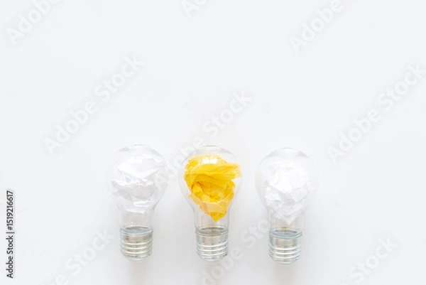 Obraz Yellow paper in light bulb, top view. Education concept. Creative idea and business innovation