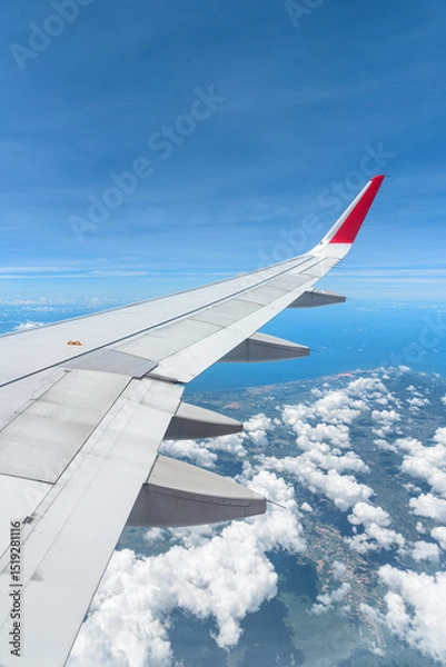 Fototapeta Awesome view of the Earth under the airplane wing