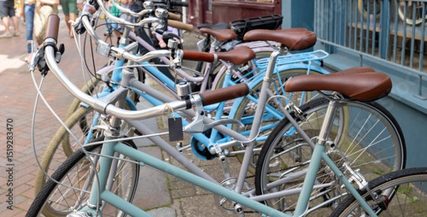 Fototapeta A row of blue parked bikes