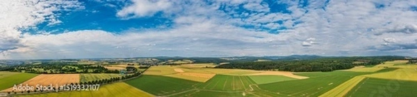 Fototapeta A bird's eye view of agricultural land on a sunny summer day in the Taunus Mountains
