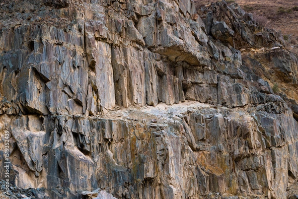 Obraz Rugged sedimentary rock formation in Kyrgyzstan mountains during daytime